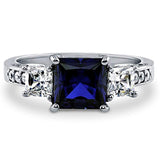 Rhodium Plated Sterling Silver Simulated Blue Sapphire Princess Cut Cubic Zirconia CZ 3-Stone Anniversary Engagement Ring