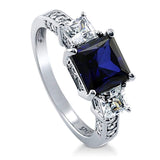 Rhodium Plated Sterling Silver Simulated Blue Sapphire Princess Cut Cubic Zirconia CZ 3-Stone Anniversary Engagement Ring