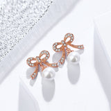 S925 sterling silver bow earrings female Korean temperament small pearl beads micro stud earrings cross-border jewelry wholesale